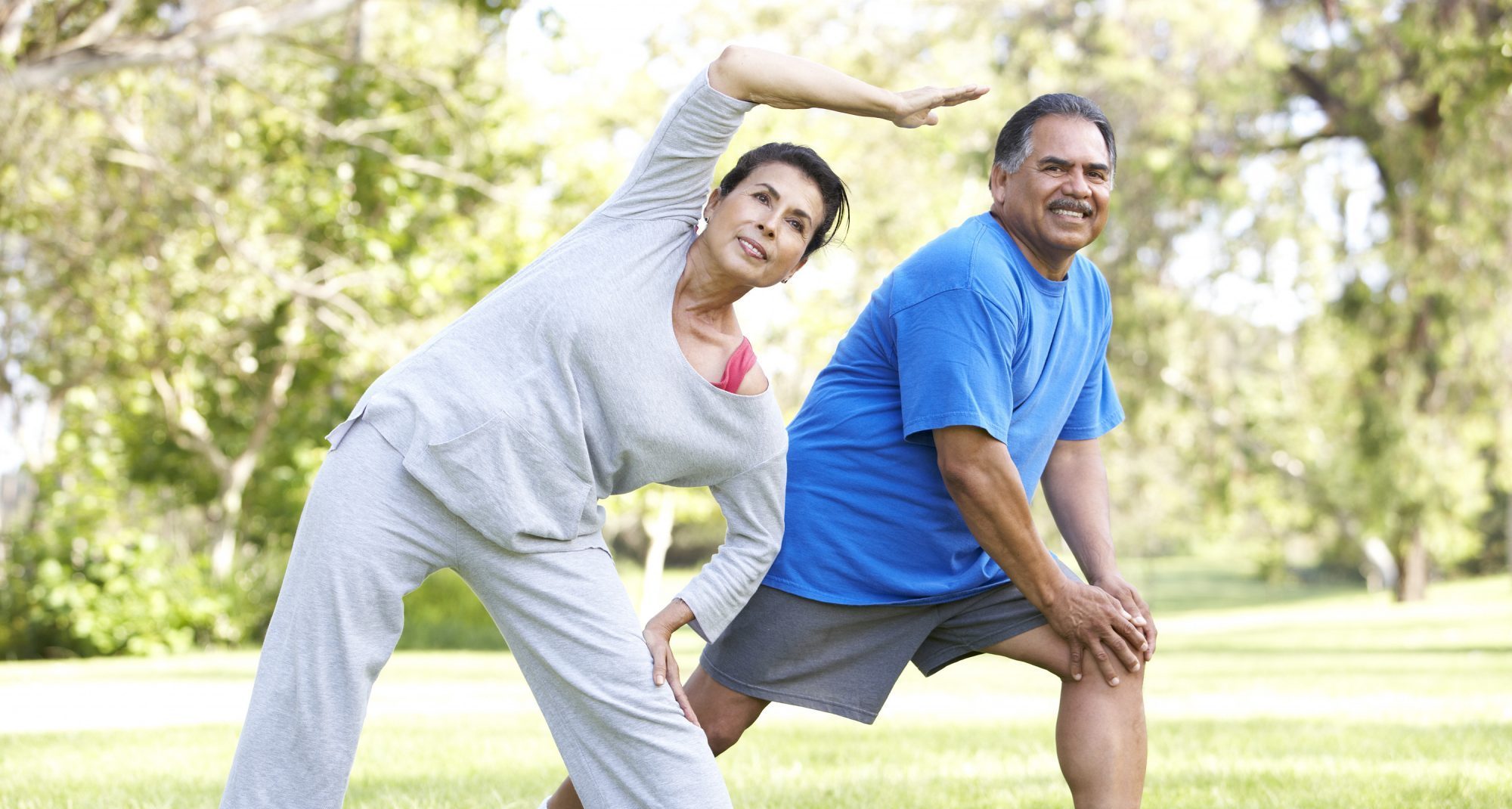 Senior Couple Exercising In Park - Kinetic Rehabilitation